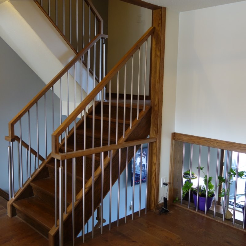 sqaure stained red oak railing with stainless steel posts and balusters